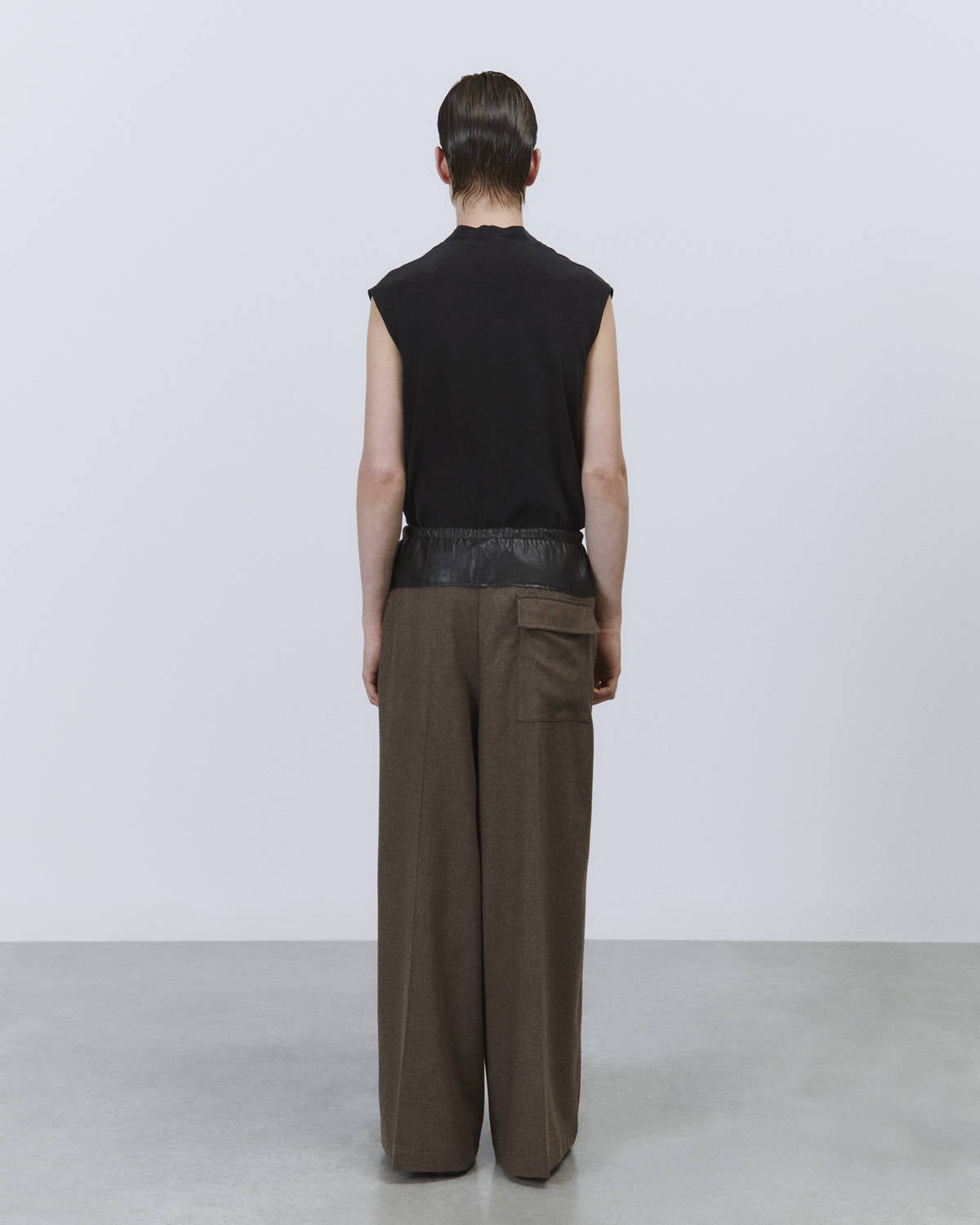 FLANNEL PANTS WITH LEATHER PEPLUM