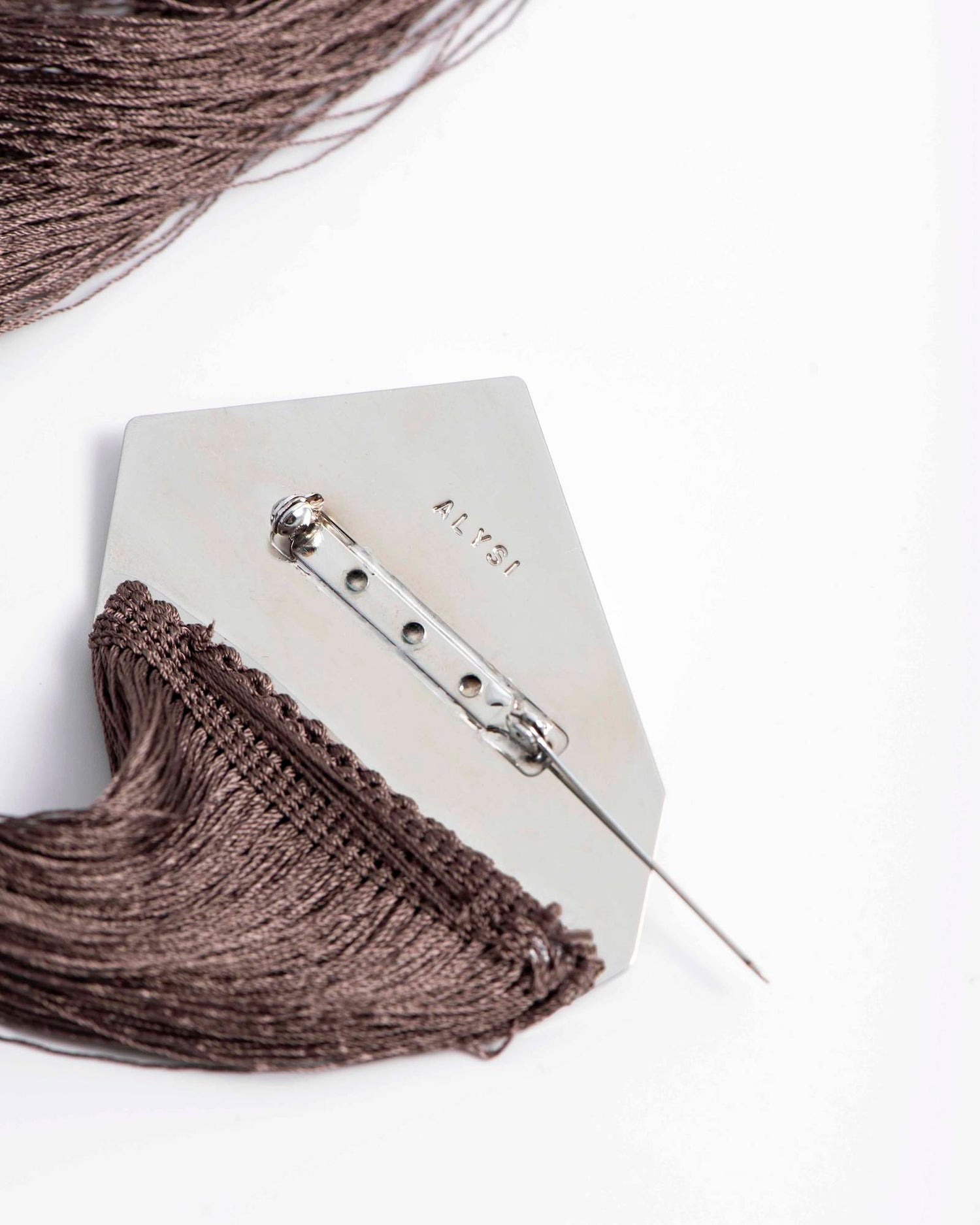 SPILLA PLACCA CON FRANGE