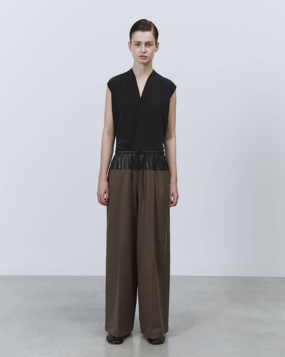 FLANNEL PANTS WITH LEATHER PEPLUM