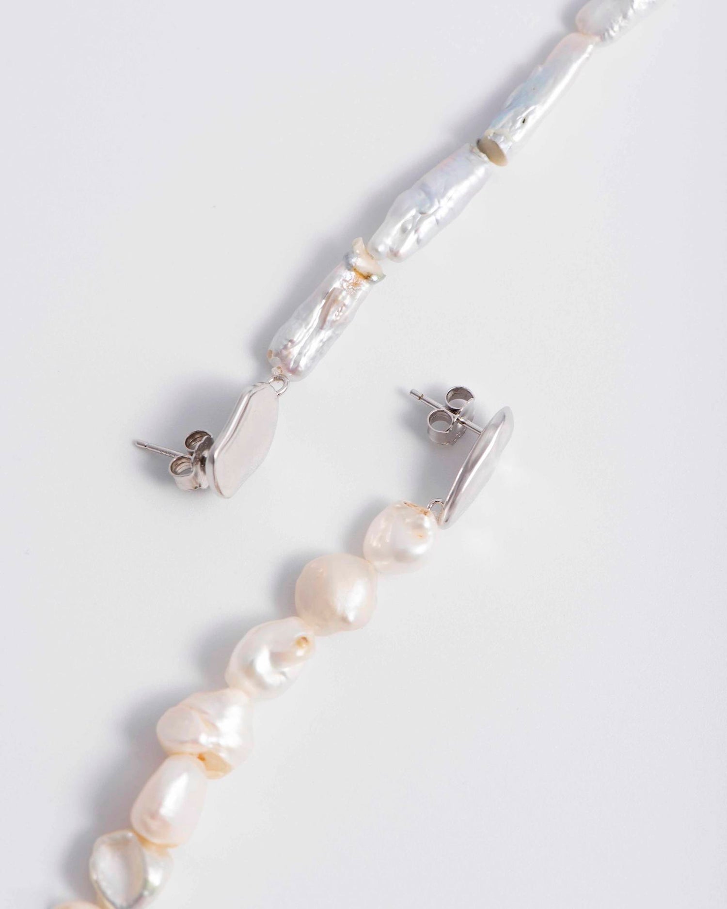 PAIR OF IRREGULAR PEARL EARRINGS