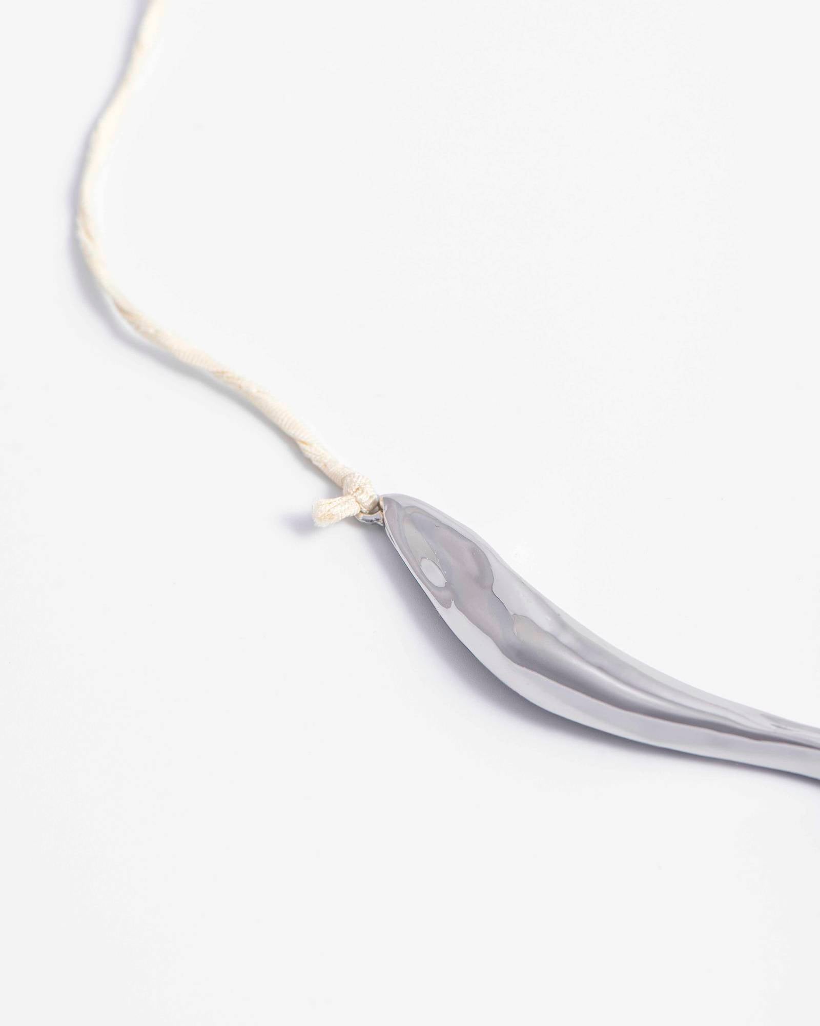 NECKLACE WITH IRREGULAR ELEMENT