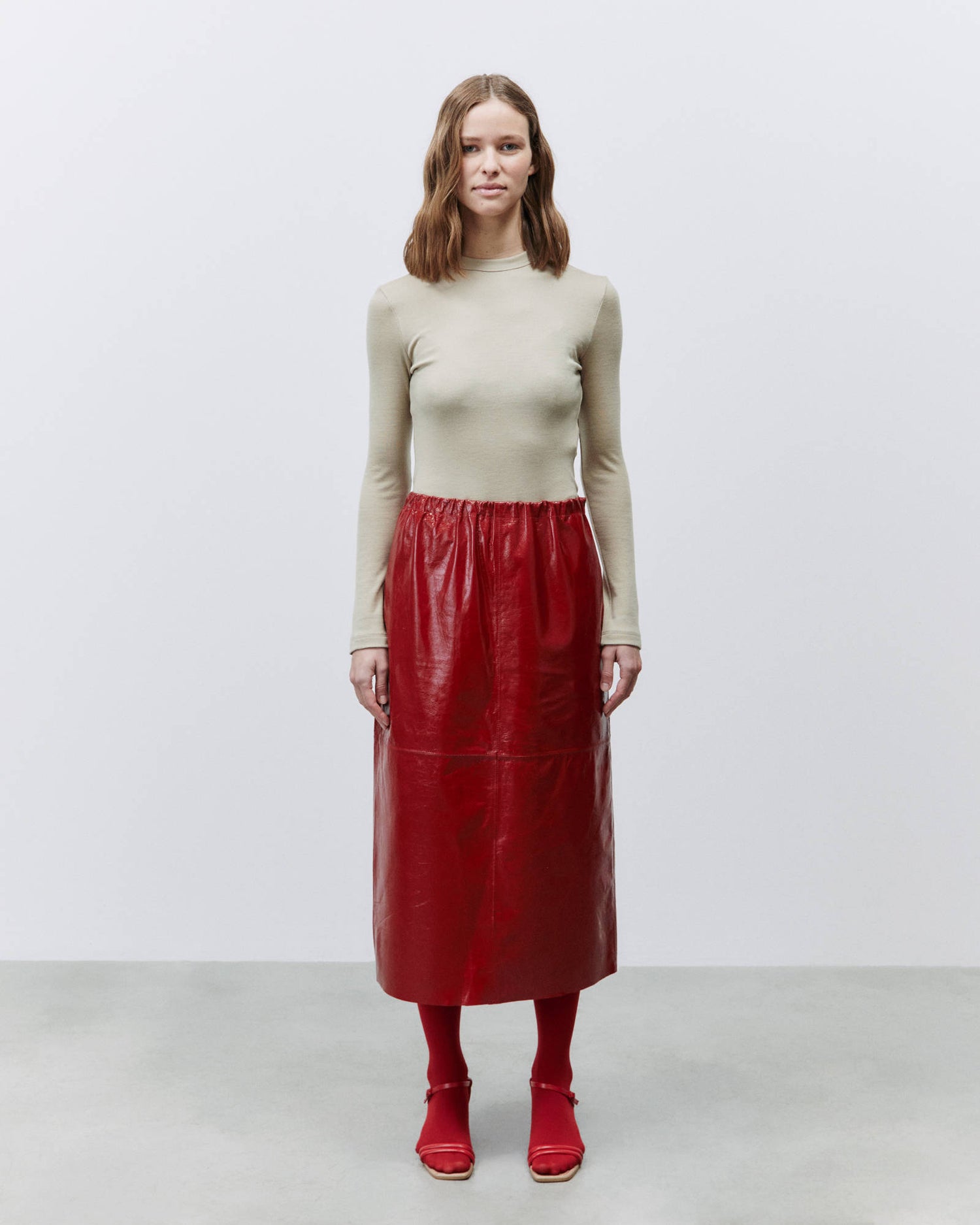 PATENT LEATHER MIDI SKIRT