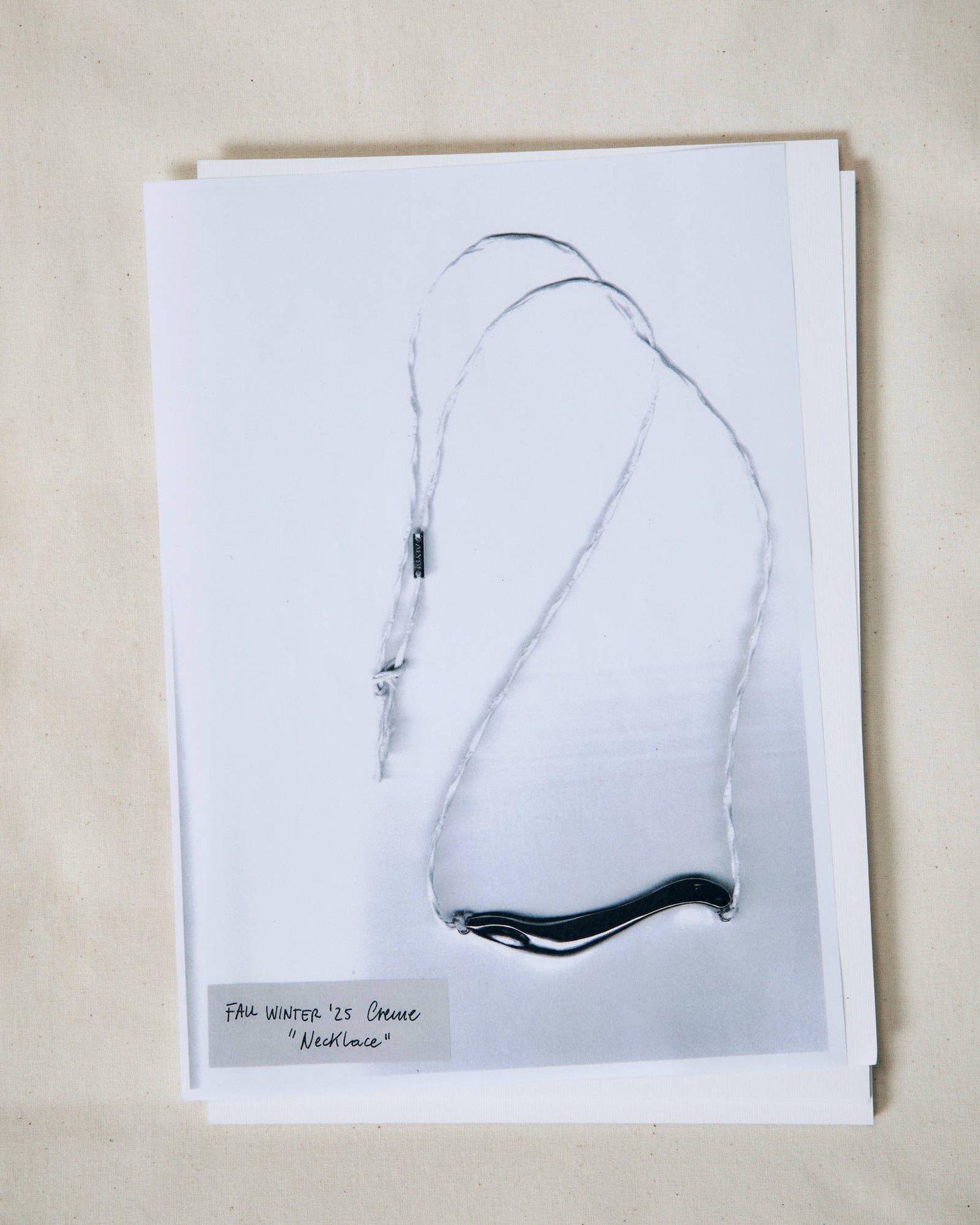 NECKLACE WITH IRREGULAR ELEMENT