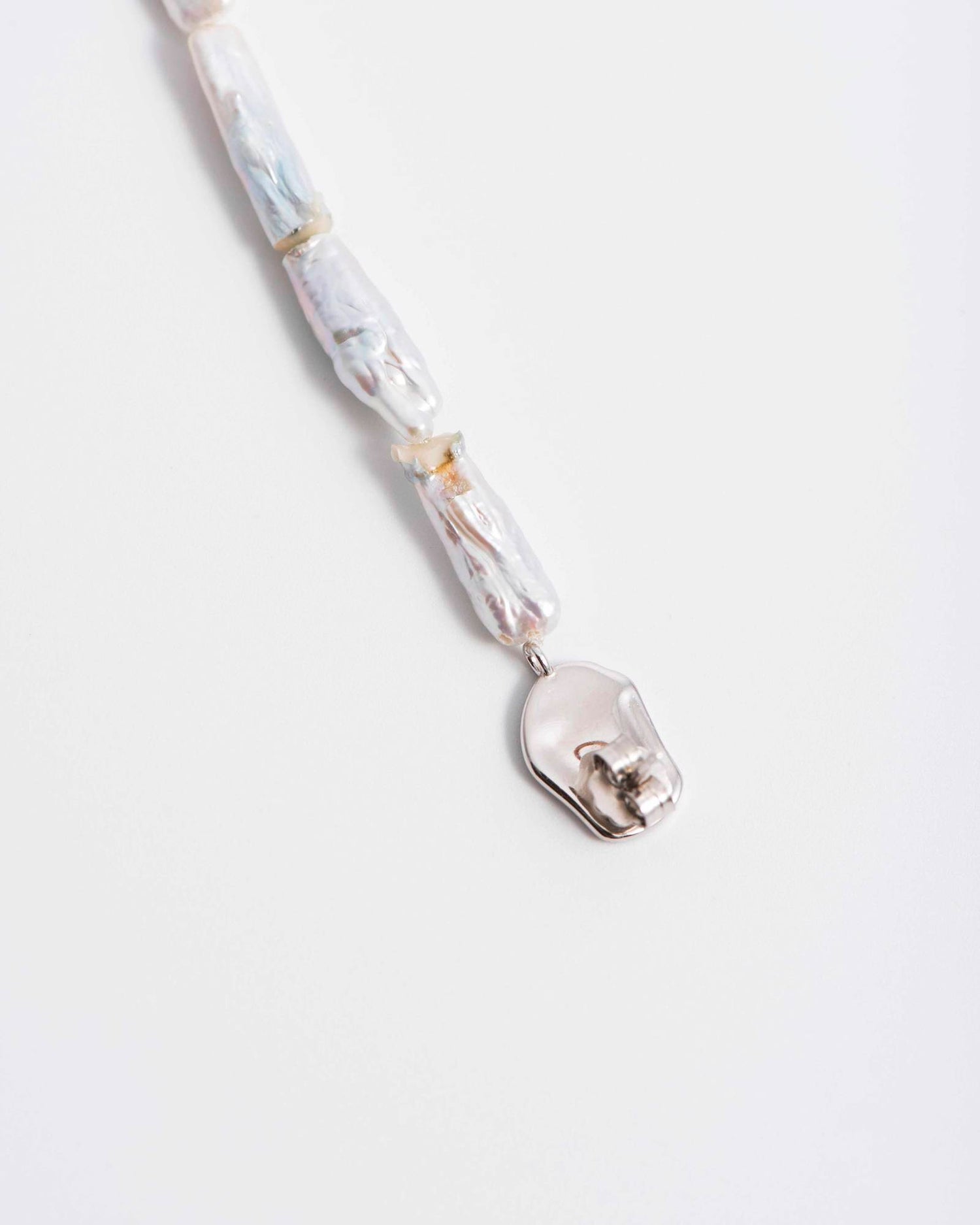PAIR OF IRREGULAR PEARL EARRINGS